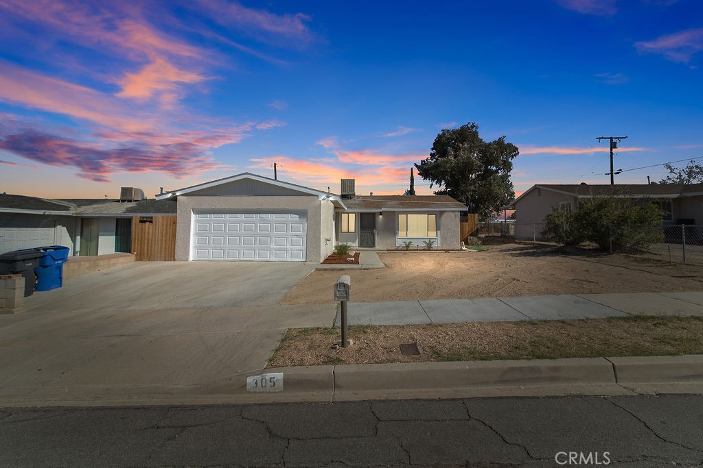 305 Ute Road Barstow, CA 92311 - Photo 1 of 1 a front view of a house with a garden