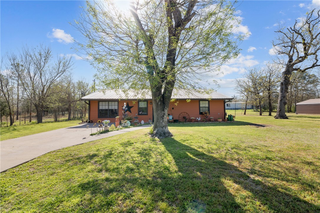 302 Dan Drive Somerville, TX 77879 - Photo 2 of 20 a view of a house with a yard