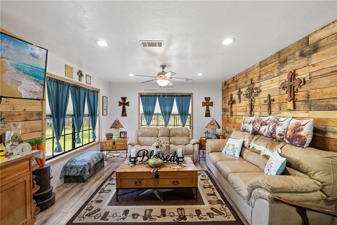 302 Dan Drive Somerville, TX 77879 - Photo 4 of 20 a living room with furniture fireplace and large window