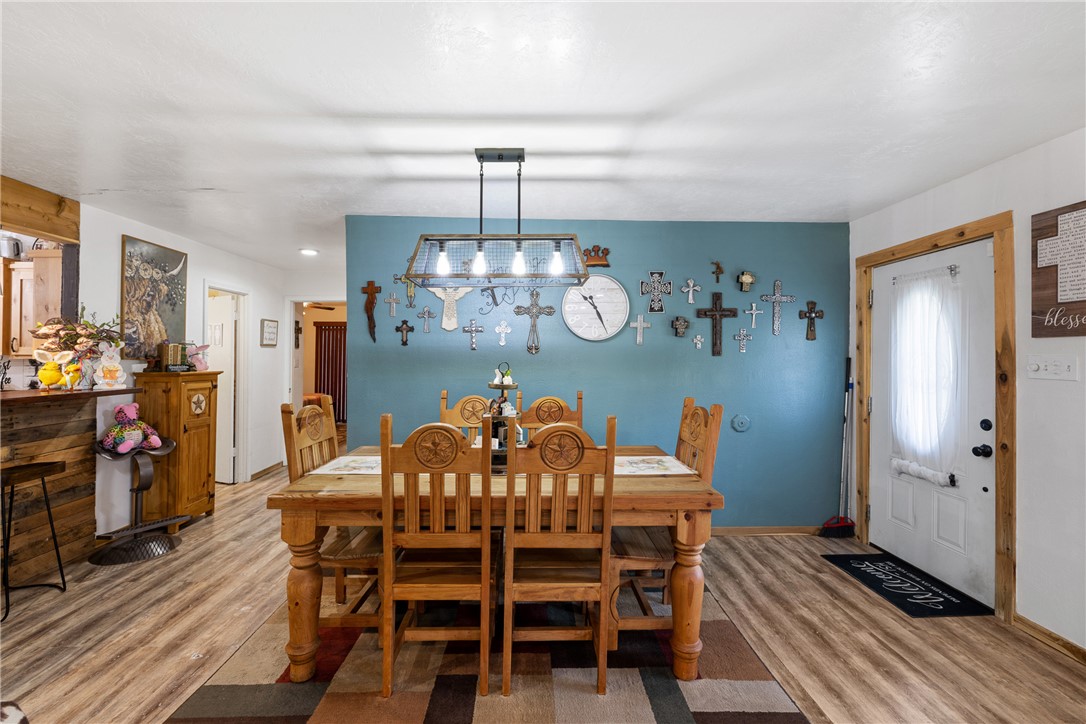 302 Dan Drive Somerville, TX 77879 - Photo 5 of 20 a view of a dining room with furniture wooden floor and chandelier