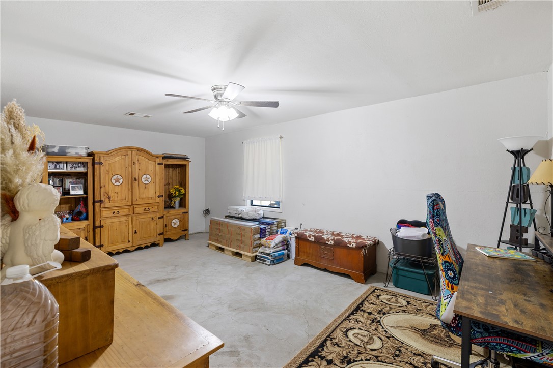 302 Dan Drive Somerville, TX 77879 - Photo 10 of 20 a bedroom with furniture and a chandelier