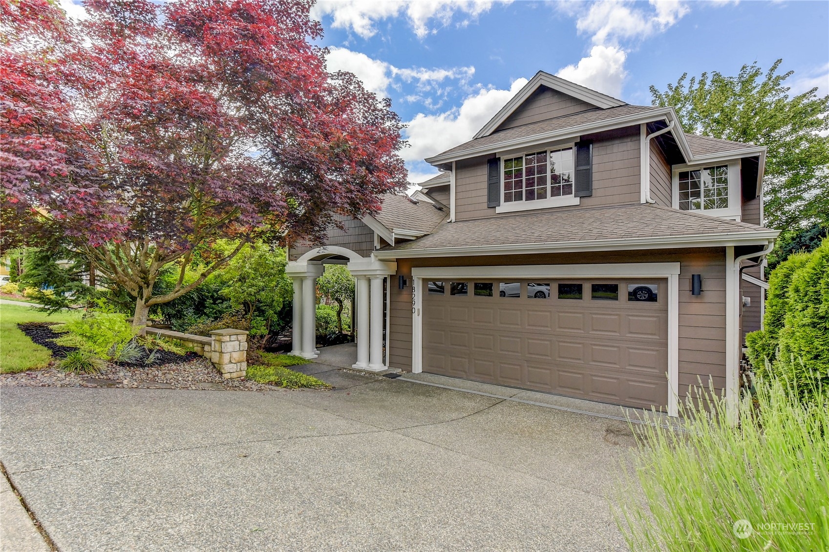 18290 Tahoma Street Southeast Monroe, WA 98272 - Photo 1 of 32 a front view of a house with garden