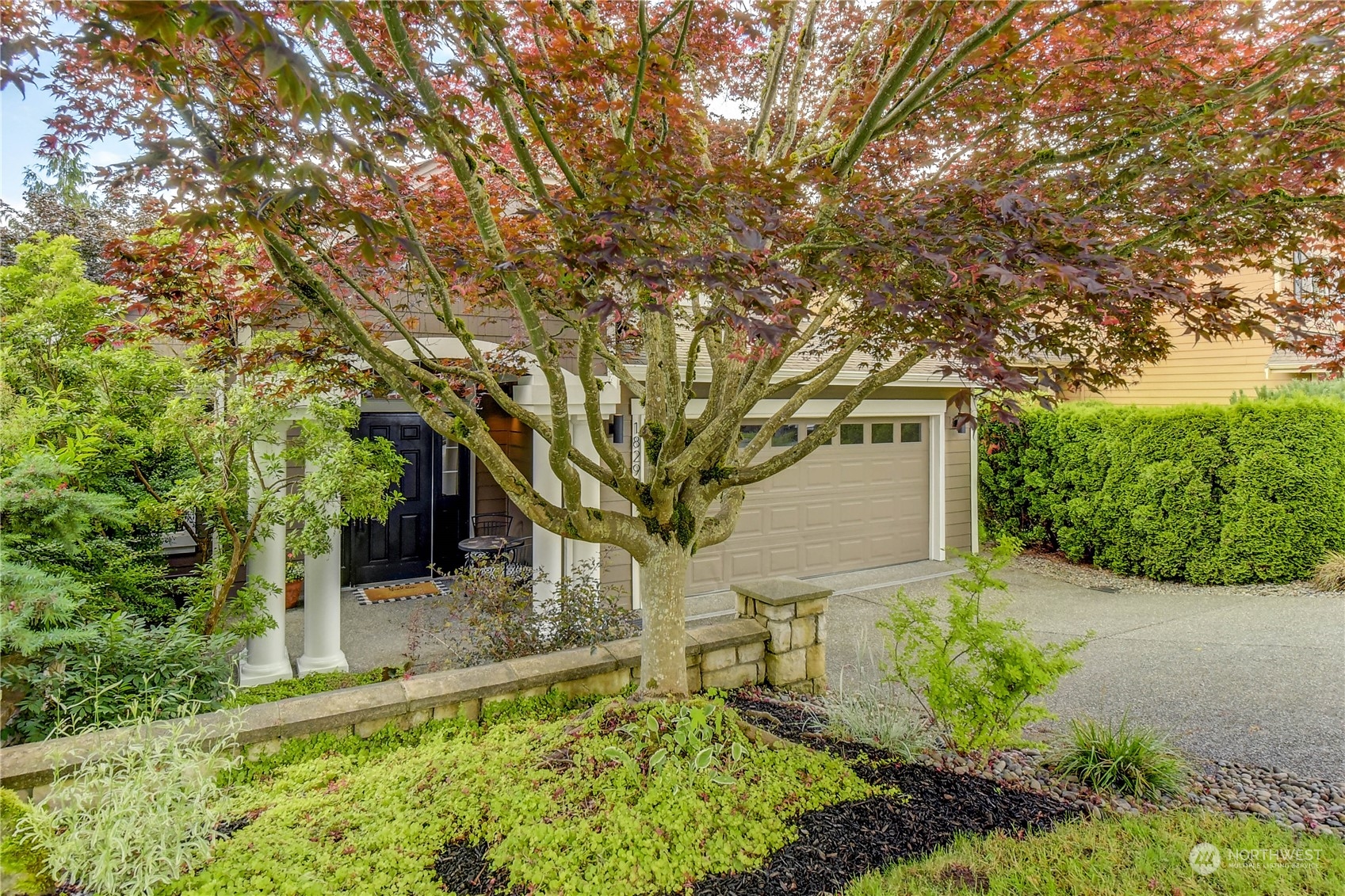 18290 Tahoma Street Southeast Monroe, WA 98272 - Photo 2 of 32 a front view of a house with garden