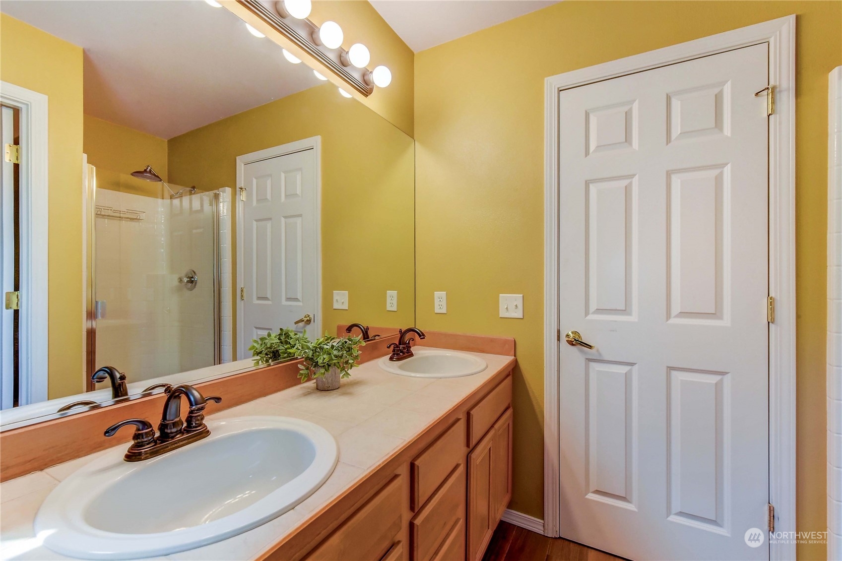 18290 Tahoma Street Southeast Monroe, WA 98272 - Photo 22 of 32 a bathroom with a double vanity sink and a mirror
