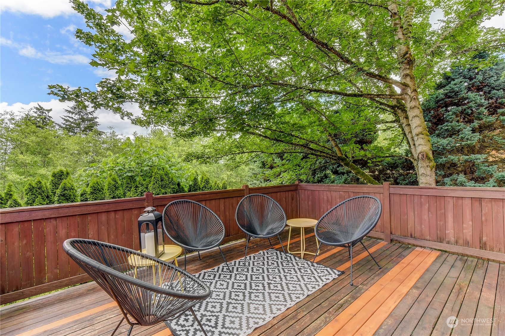 18290 Tahoma Street Southeast Monroe, WA 98272 - Photo 27 of 32 a view of balcony with wooden floor and outdoor seating