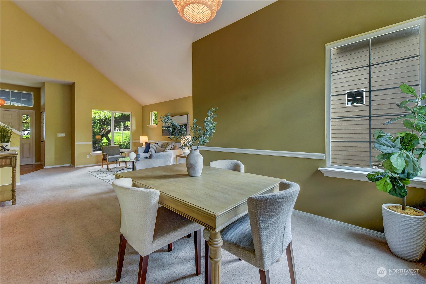 18290 Tahoma Street Southeast Monroe, WA 98272 - Photo 9 of 32 a dining room with furniture and potted plants
