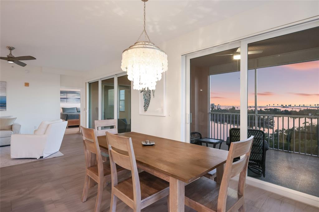 13113 Gasparilla Road, Unit 503 Placida, FL 33946 - Photo 13 of 87 a view of a dining room with furniture window and wooden floor