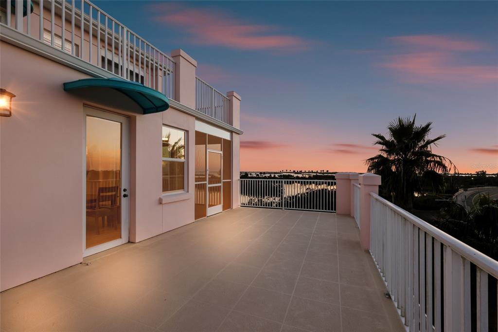 13113 Gasparilla Road, Unit 503 Placida, FL 33946 - Photo 20 of 87 a view of a porch with furniture and floor to ceiling window