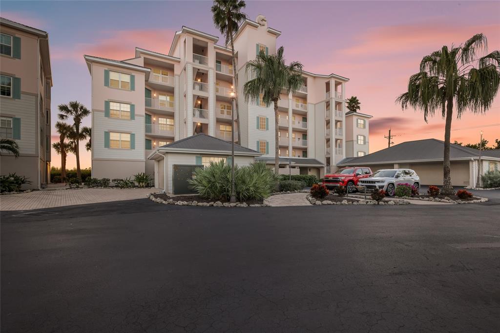 13113 Gasparilla Road, Unit 503 Placida, FL 33946 - Photo 40 of 87 a cars parked in front of a building