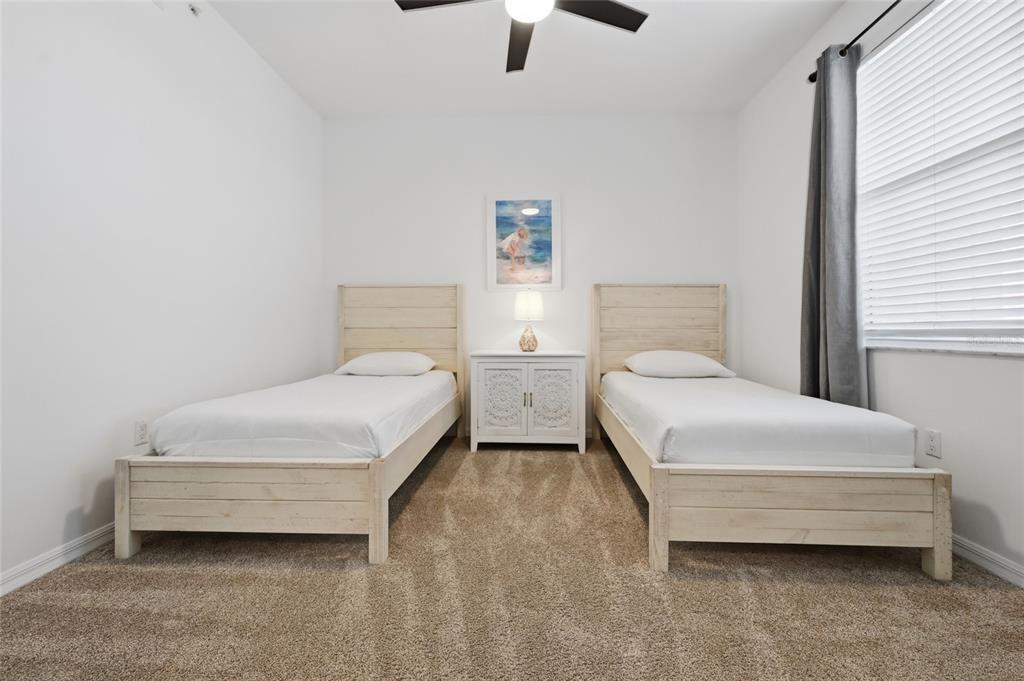 13113 Gasparilla Road, Unit 503 Placida, FL 33946 - Photo 60 of 87 a bedroom with a bed and a chandelier