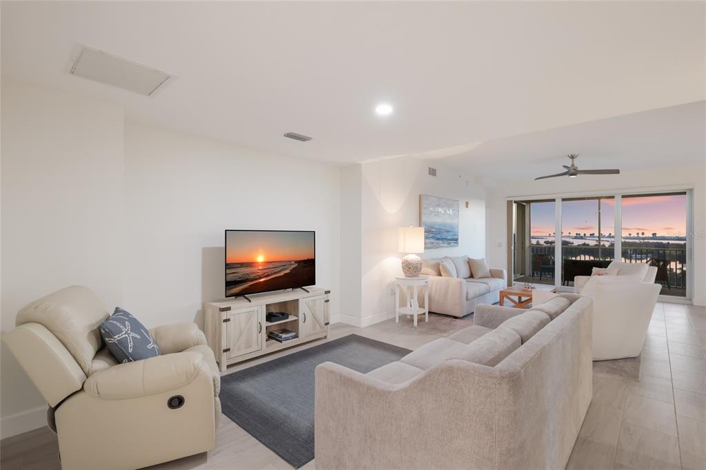 13113 Gasparilla Road, Unit 503 Placida, FL 33946 - Photo 6 of 87 a living room with furniture and a flat screen tv