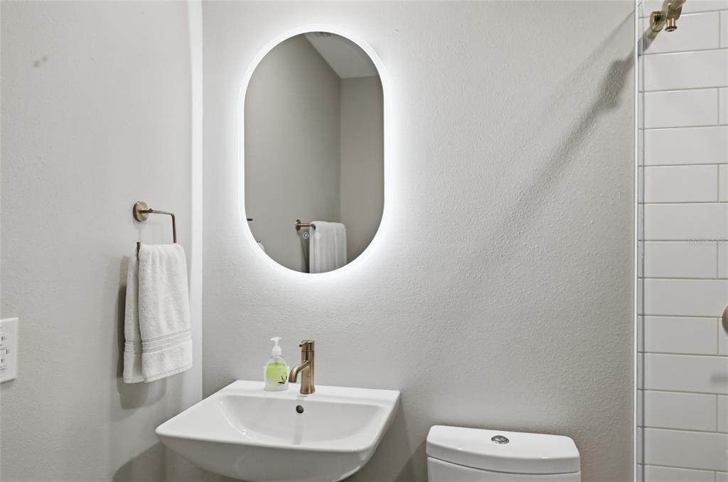 13113 Gasparilla Road, Unit 503 Placida, FL 33946 - Photo 62 of 87 a bathroom with a toilet sink and mirror