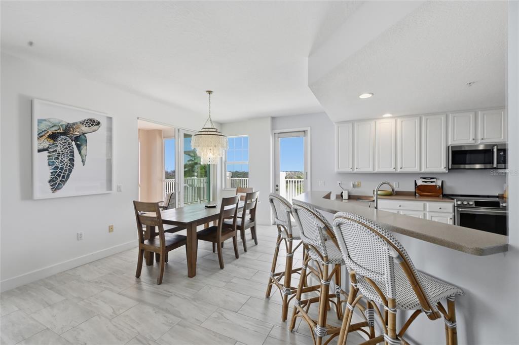13113 Gasparilla Road, Unit 503 Placida, FL 33946 - Photo 67 of 87 a view of a dining room with furniture window and outside view