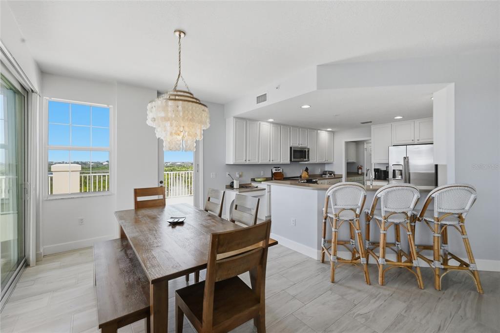 13113 Gasparilla Road, Unit 503 Placida, FL 33946 - Photo 68 of 87 a view of a dining room with furniture window and wooden floor