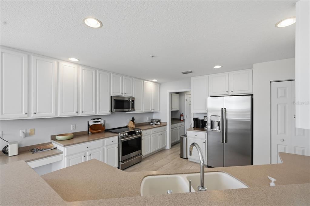 13113 Gasparilla Road, Unit 503 Placida, FL 33946 - Photo 69 of 87 a kitchen with stainless steel appliances granite countertop a refrigerator sink and stove