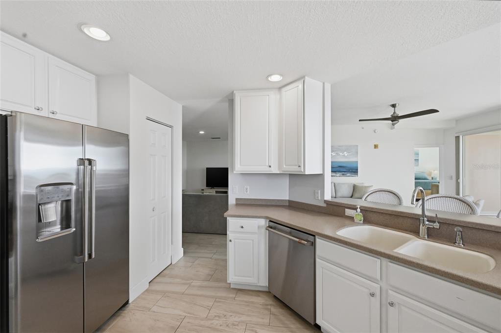13113 Gasparilla Road, Unit 503 Placida, FL 33946 - Photo 73 of 87 a kitchen with a sink refrigerator and cabinets