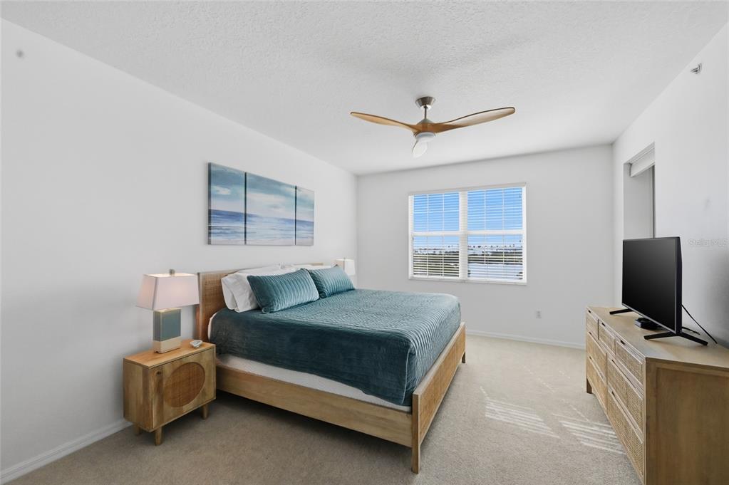 13113 Gasparilla Road, Unit 503 Placida, FL 33946 - Photo 75 of 87 a bedroom with a bed and a flat screen tv