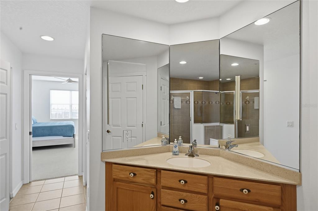 13113 Gasparilla Road, Unit 503 Placida, FL 33946 - Photo 77 of 87 a en suite bathroom with a granite countertop sink and mirror