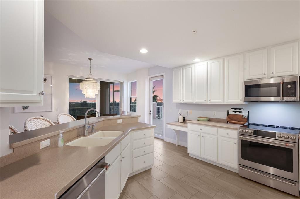 13113 Gasparilla Road, Unit 503 Placida, FL 33946 - Photo 10 of 87 a kitchen with a sink stove top oven and refrigerator