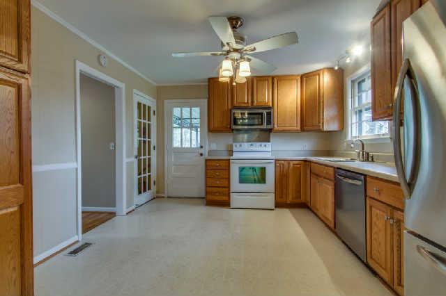 Kitchen has lots of over and under counter space with a floor-to-ceiling pantry