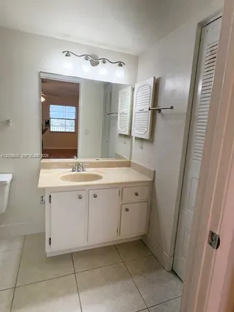 a view of a hallway to rooms
