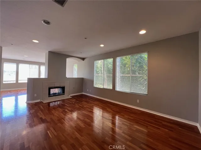 a bathroom with a sink double vanity granite and a mirror