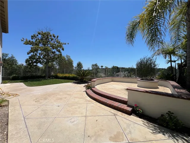 a white toilet and tub sitting next to a bathroom sink