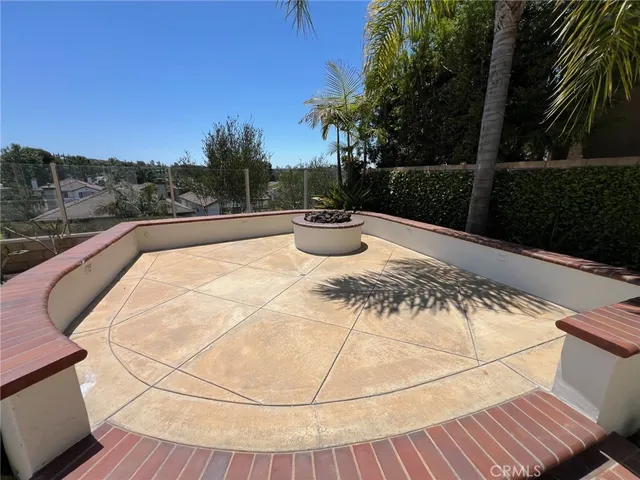 an empty room with a window and a ceiling fan