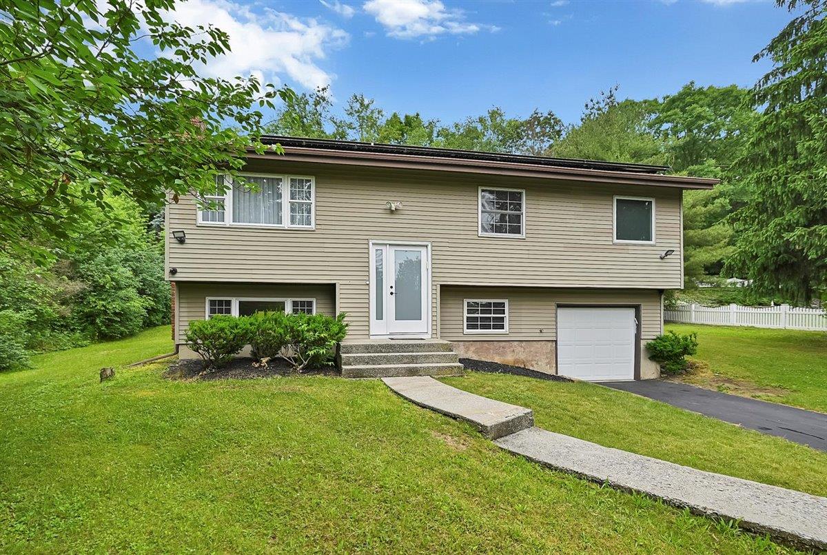 9 Laroc Road Chester, NY 10918 - Photo 1 of 1 Split foyer home featuring a front lawn and a garage