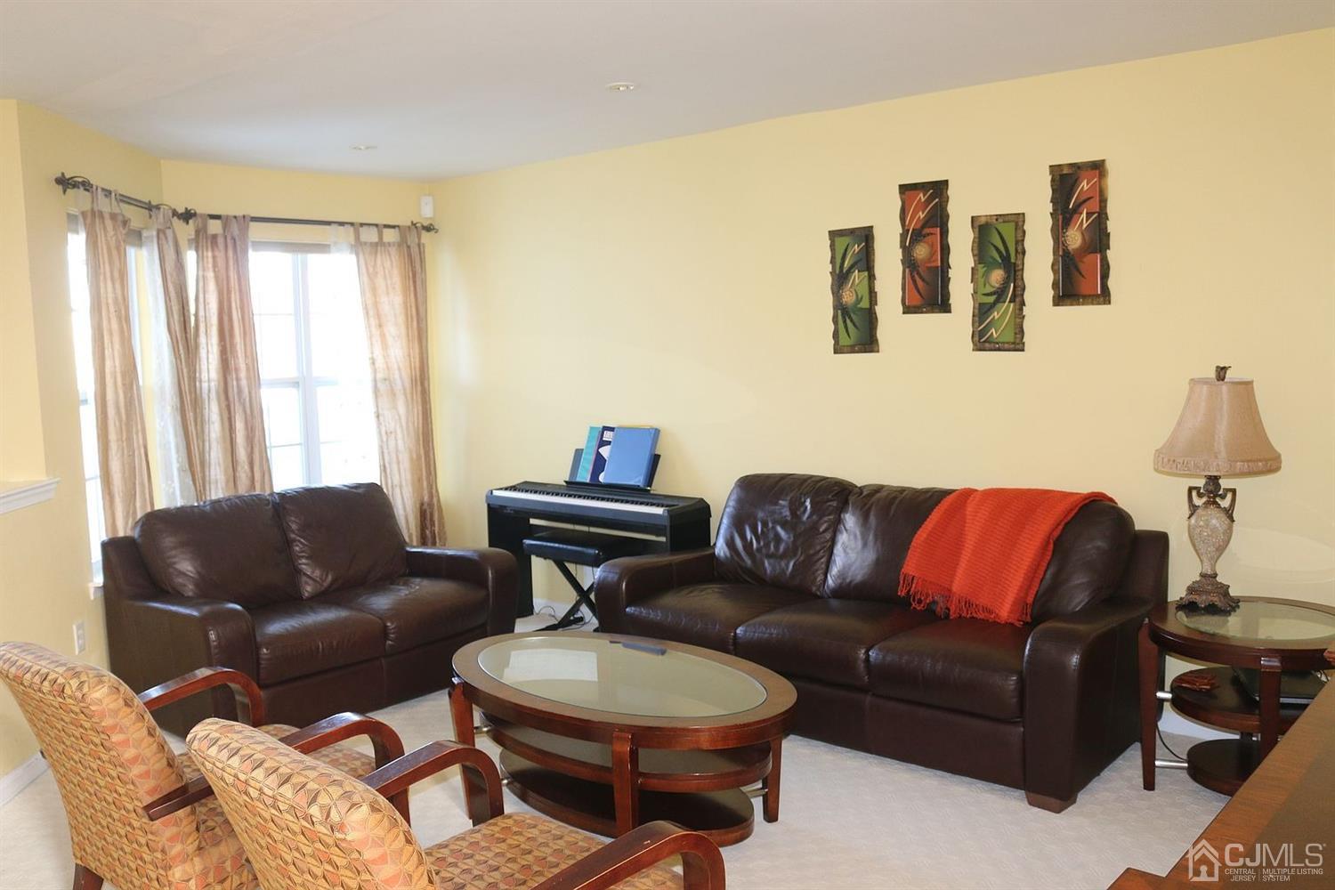 354 Hawthorne Road North Brunswick, NJ 08902 - Photo 1 of 9 a living room with furniture a couch and a window