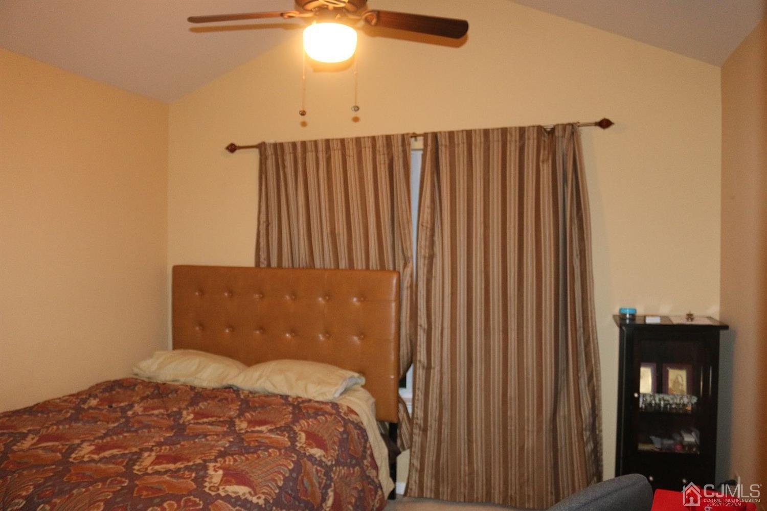 354 Hawthorne Road North Brunswick, NJ 08902 - Photo 2 of 9 a bedroom with a bed and painting on the wall
