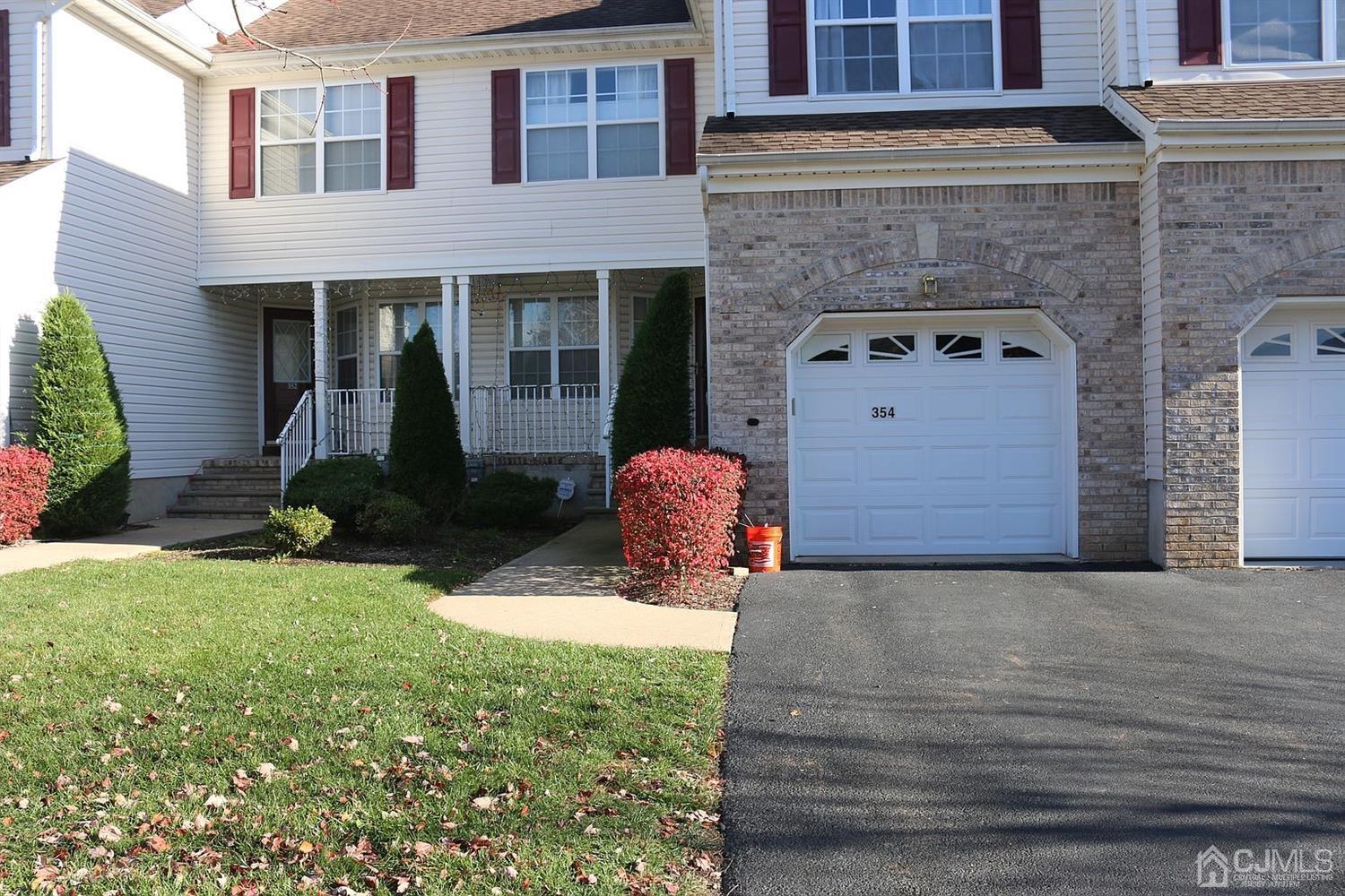 354 Hawthorne Road North Brunswick, NJ 08902 - Photo 7 of 9 a front view of a house with garden