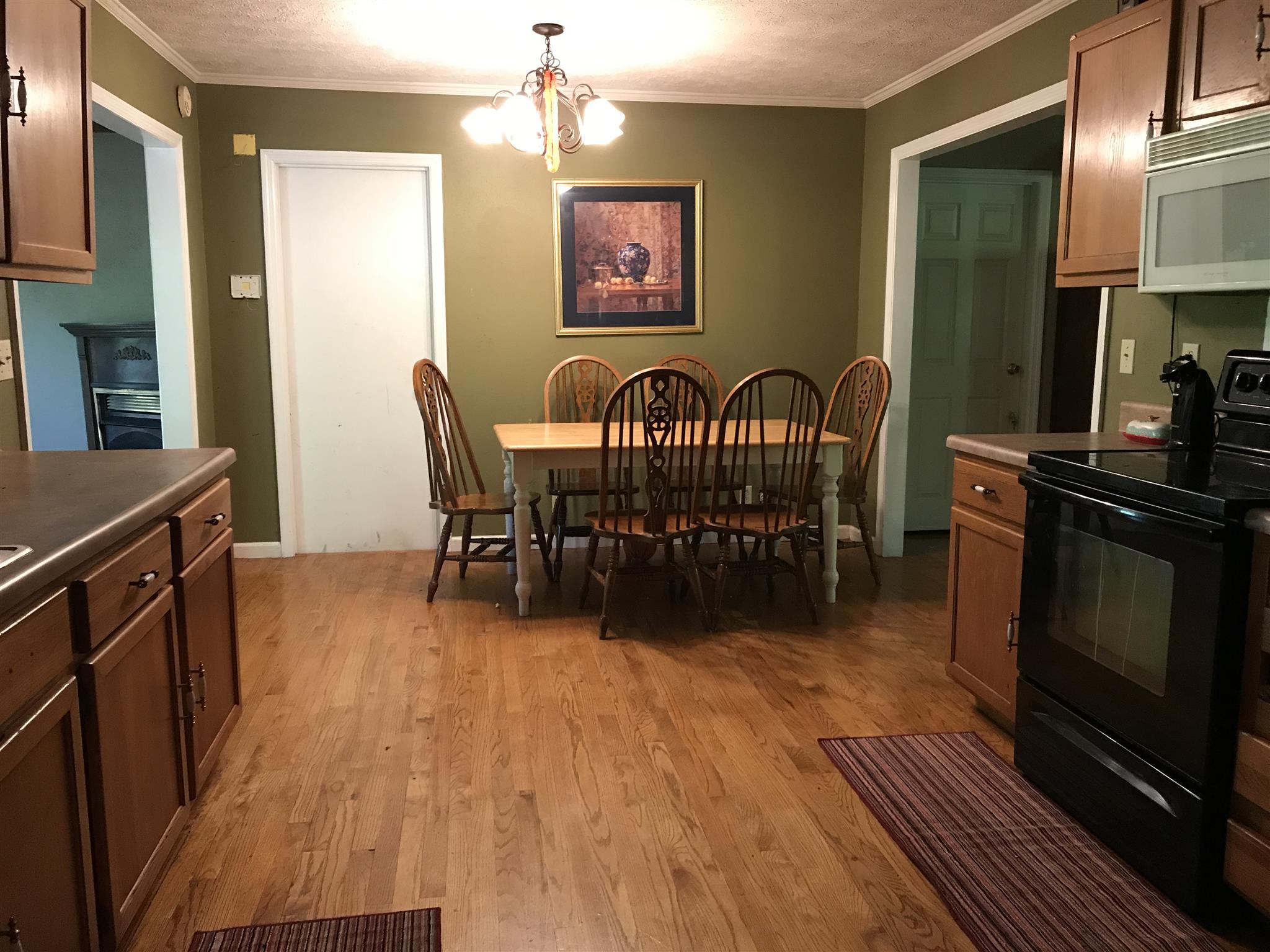 3996 Fairview Road Columbia, TN 38401 - Photo 5 of 18 a view of a kitchen with dining room and wooden floor