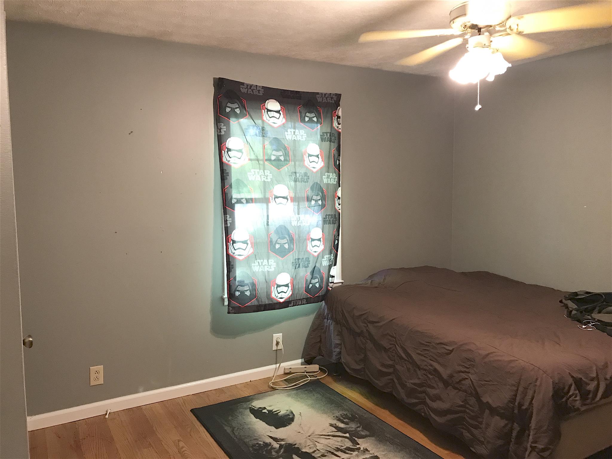 3996 Fairview Road Columbia, TN 38401 - Photo 10 of 18 a bedroom with a bed and a window