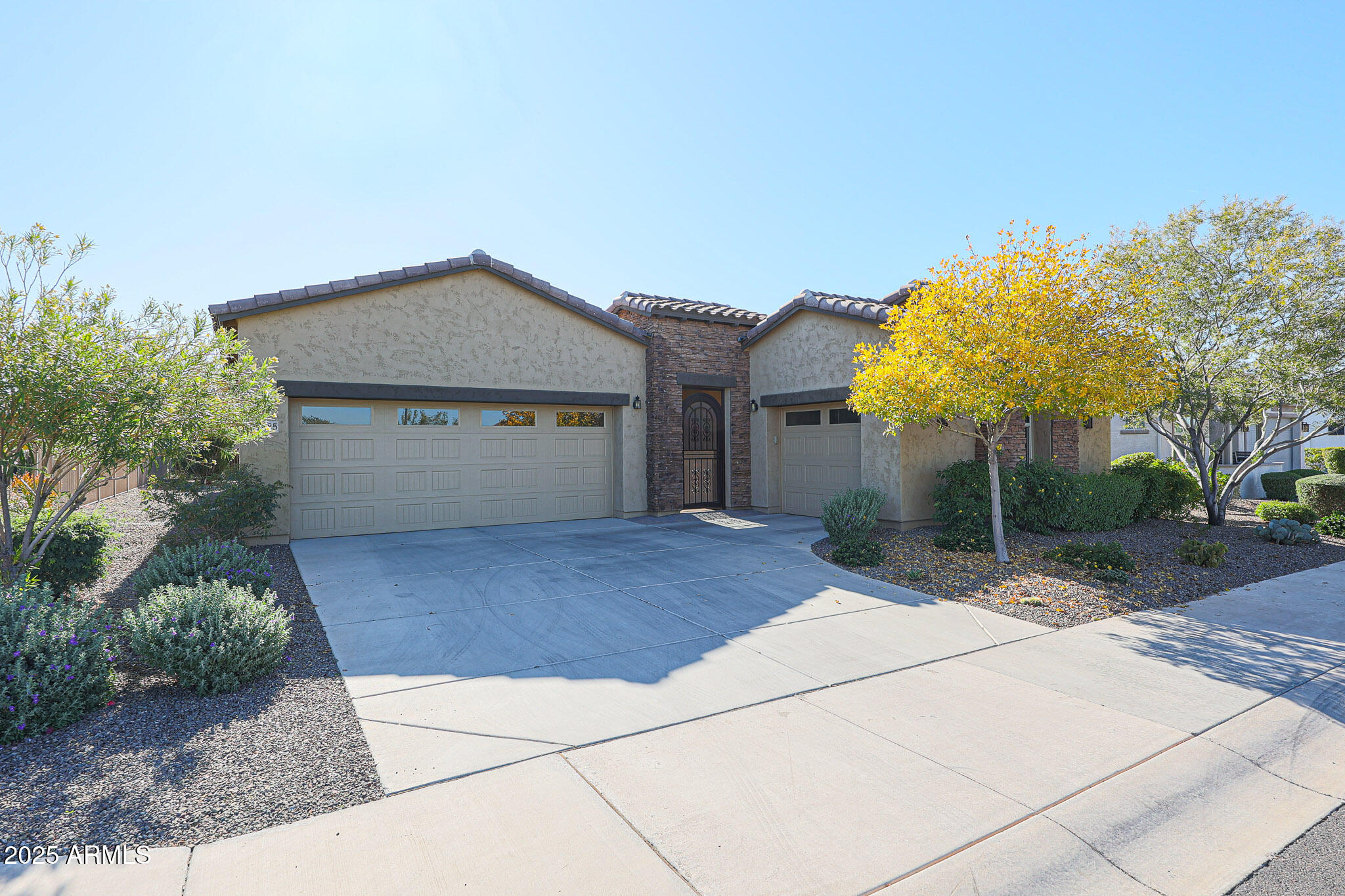 17885 West Ashurst Drive Goodyear, AZ 85338 - Photo 1 of 63 a front view of a house with a yard and garage