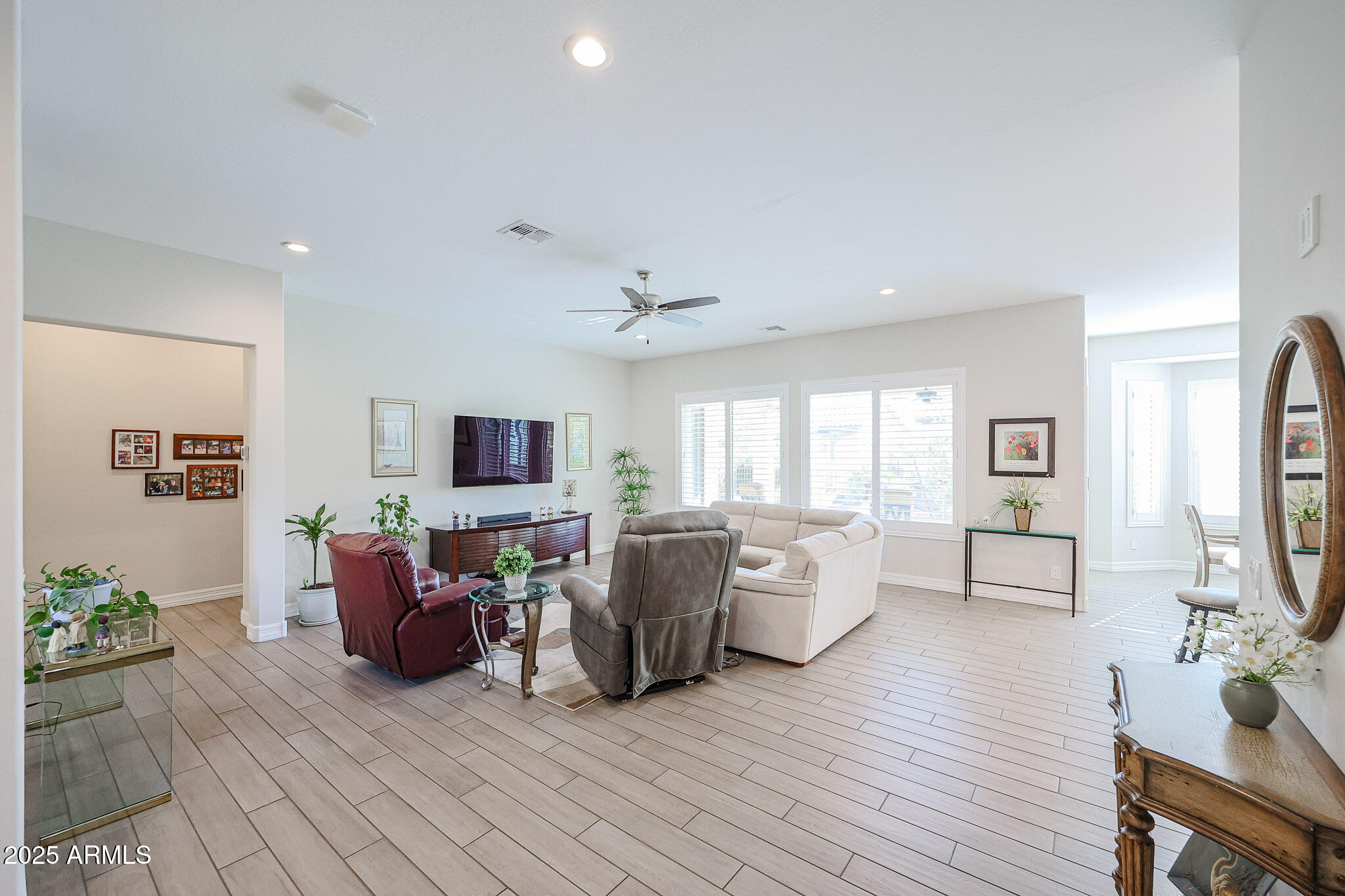 17885 West Ashurst Drive Goodyear, AZ 85338 - Photo 14 of 63 a living room with furniture and a flat screen tv