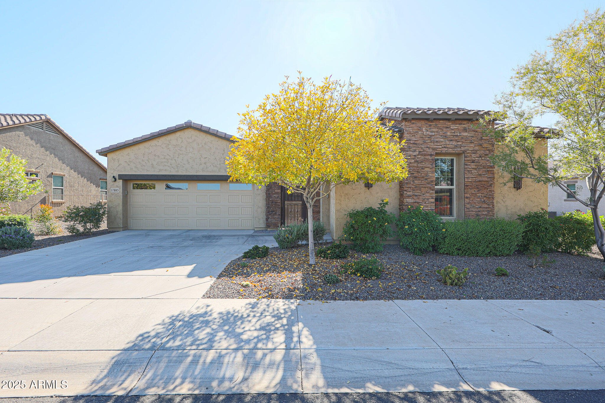17885 West Ashurst Drive Goodyear, AZ 85338 - Photo 2 of 63 a front view of a house with a yard and garage