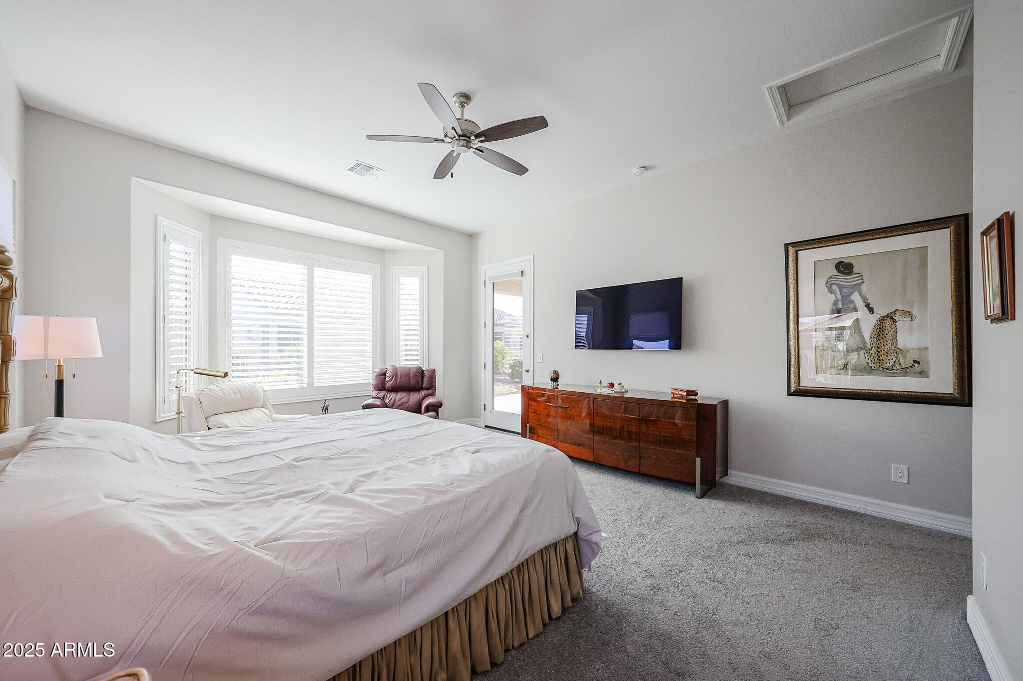 17885 West Ashurst Drive Goodyear, AZ 85338 - Photo 22 of 63 a bedroom with a bed and a flat screen tv