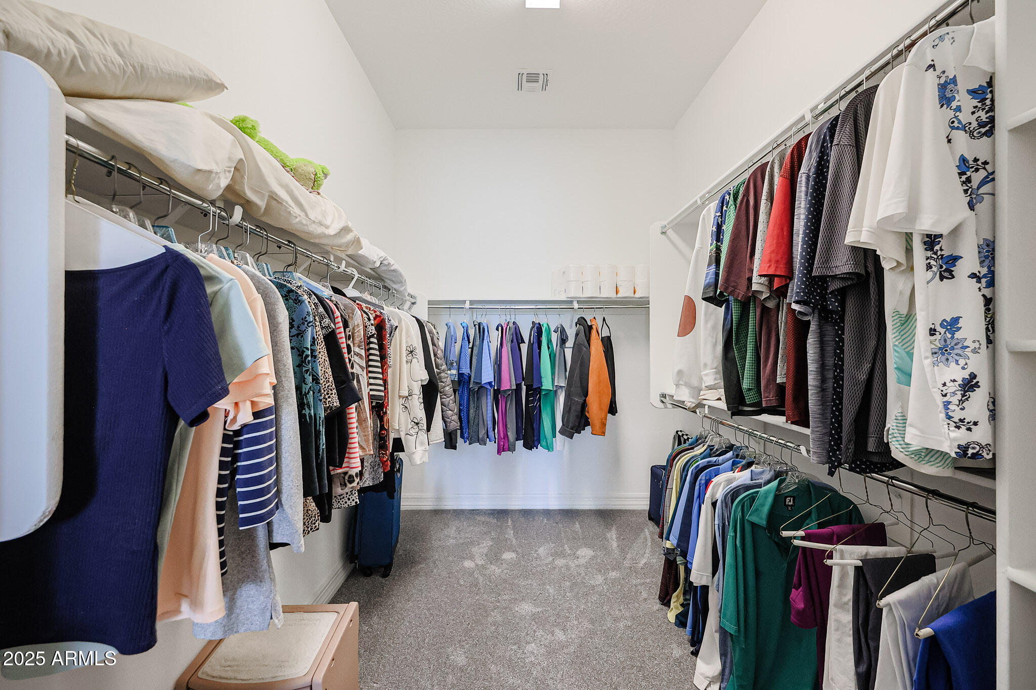 17885 West Ashurst Drive Goodyear, AZ 85338 - Photo 27 of 63 a view of walk in closet with clothes