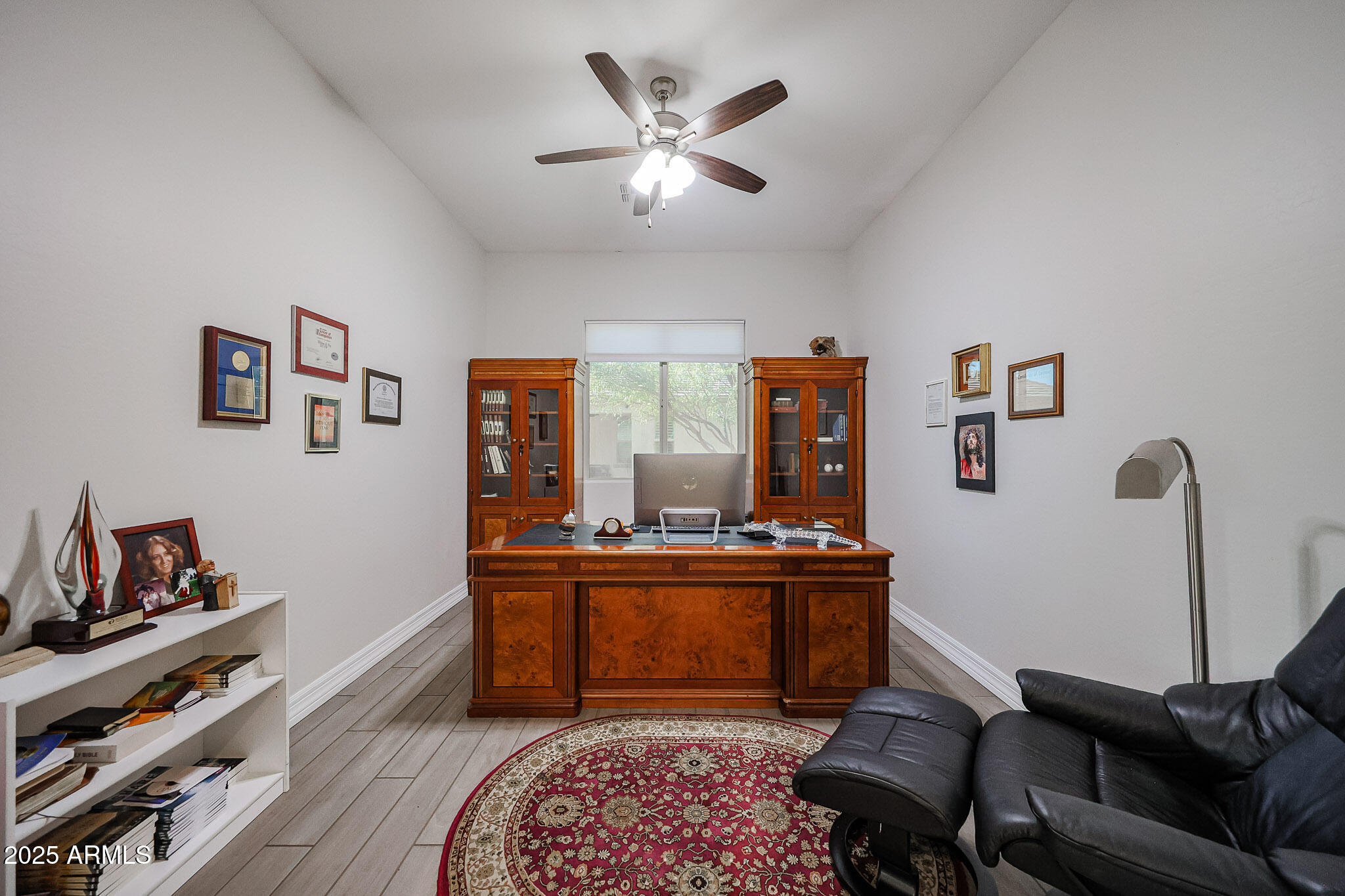 17885 West Ashurst Drive Goodyear, AZ 85338 - Photo 31 of 63 a living room with furniture and wooden floor