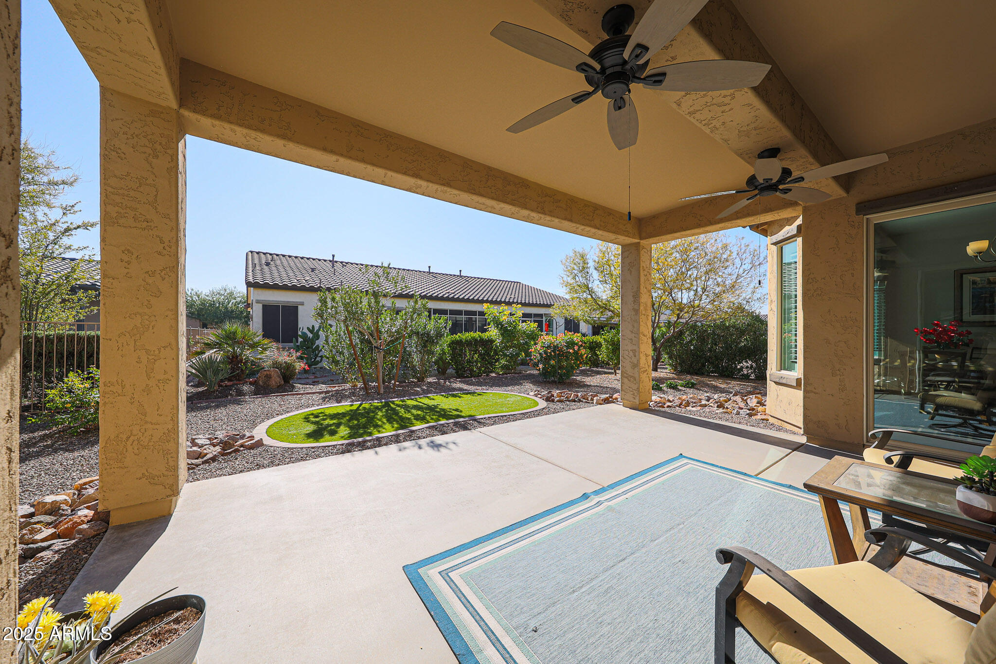 17885 West Ashurst Drive Goodyear, AZ 85338 - Photo 35 of 63 a view of a patio with a table and chairs