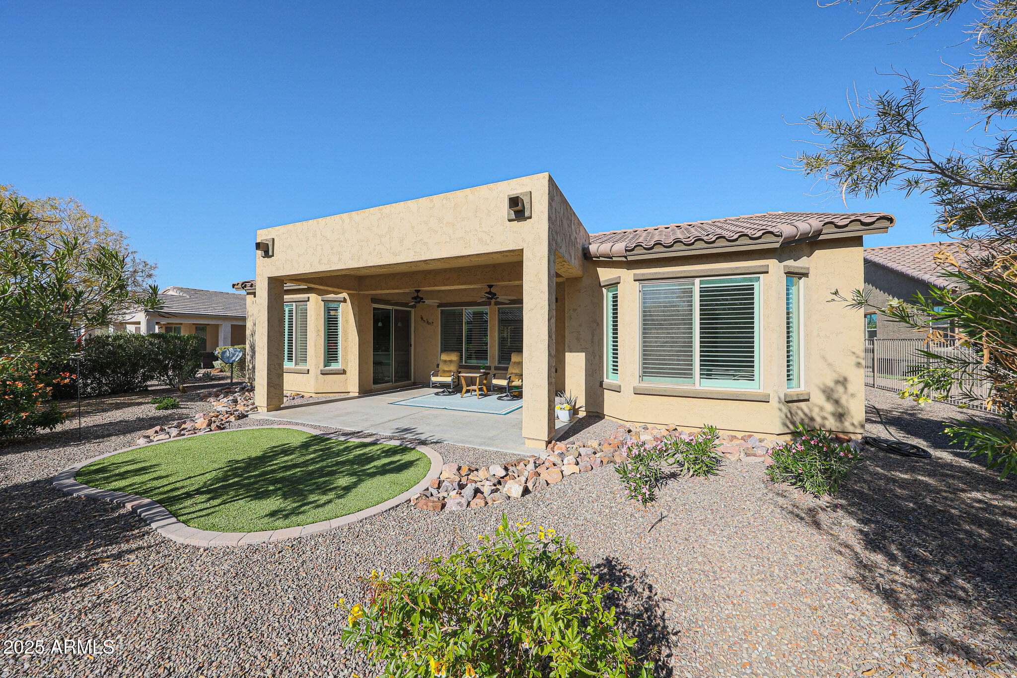 17885 West Ashurst Drive Goodyear, AZ 85338 - Photo 36 of 63 a front view of a house with garden