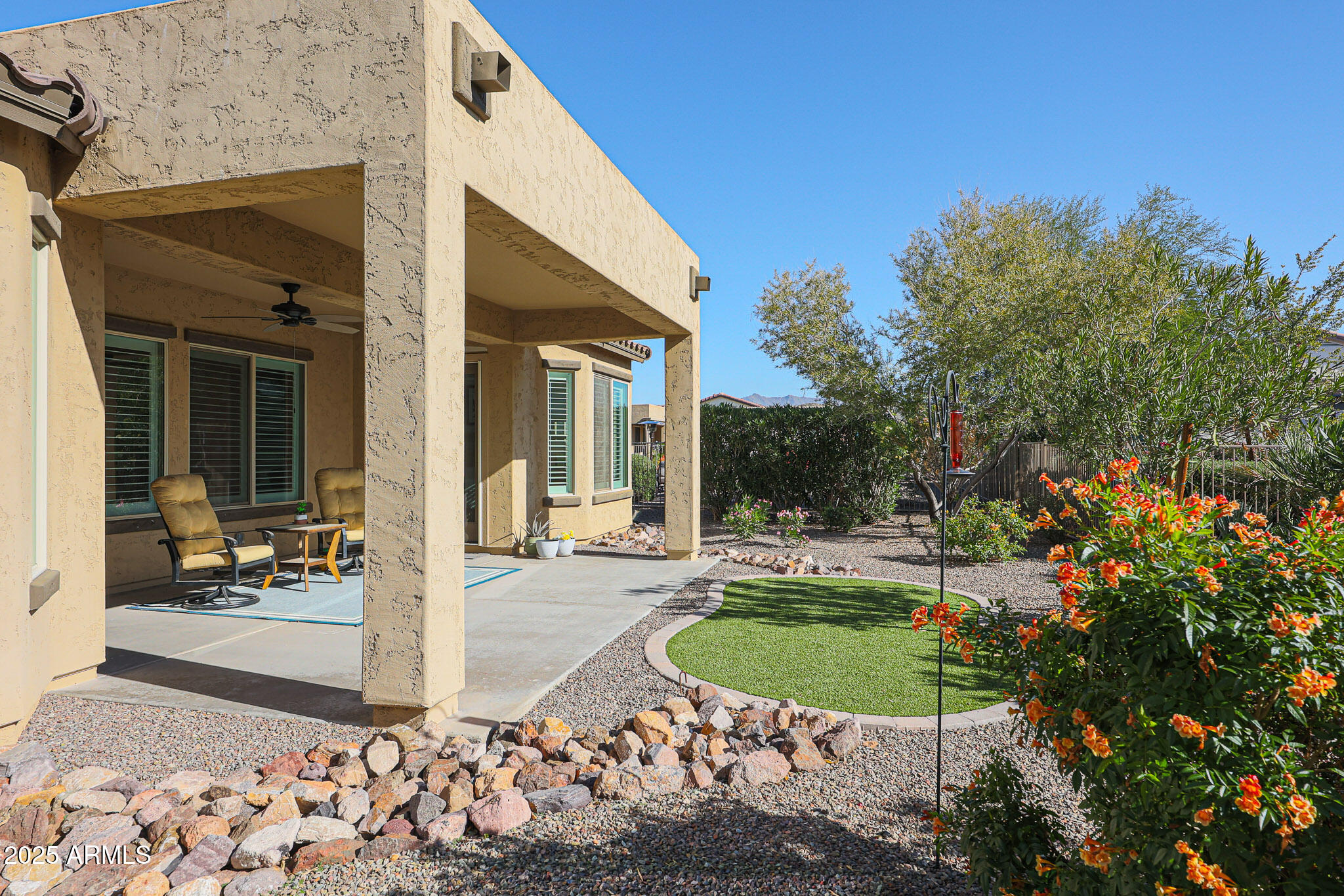 17885 West Ashurst Drive Goodyear, AZ 85338 - Photo 38 of 63 a view of a house with backyard porch and sitting area