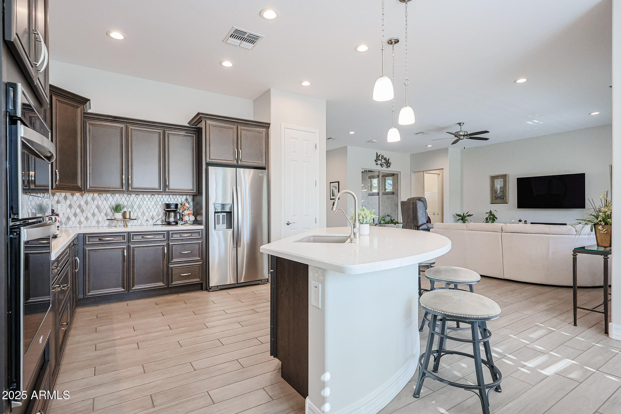 17885 West Ashurst Drive Goodyear, AZ 85338 - Photo 10 of 63 a kitchen with a sink stainless steel appliances and cabinets