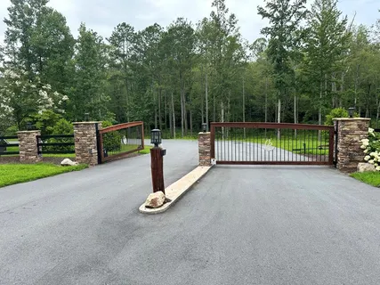 a view of a park with iron fence