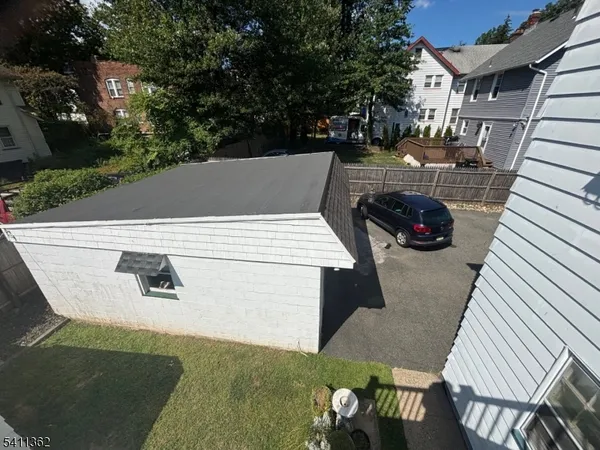 an aerial view of a house with patio
