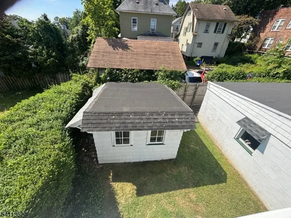 aerial view of a house with a yard