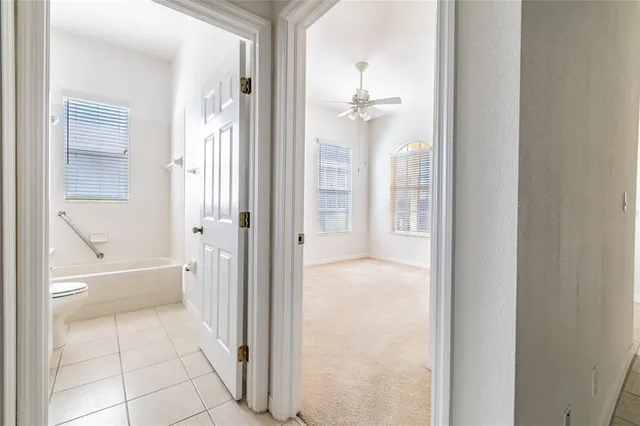 a bathroom with a glass shower door and a bathtub