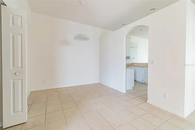 an empty room with white walls