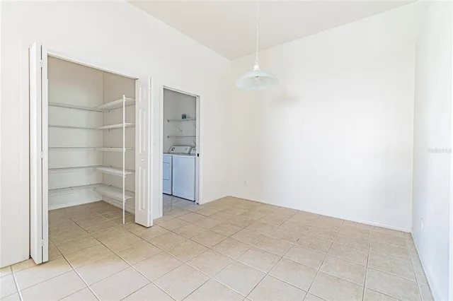 an empty room with shelves